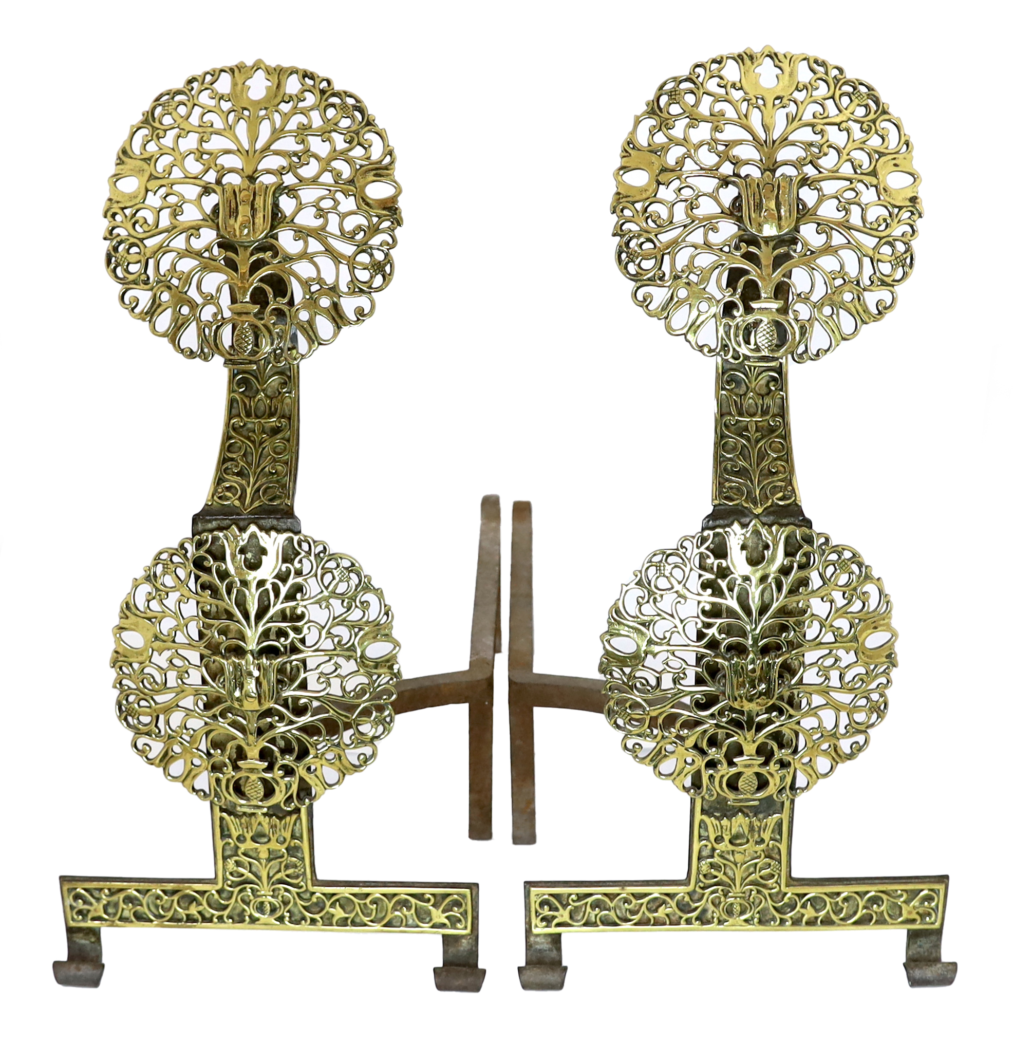 A pair of Arts & Crafts cast iron and pierced brass firedogs, in the manner of Edward Spencer and the Artificers' Guild, 30cm wide, 56cm deep, 81cm high